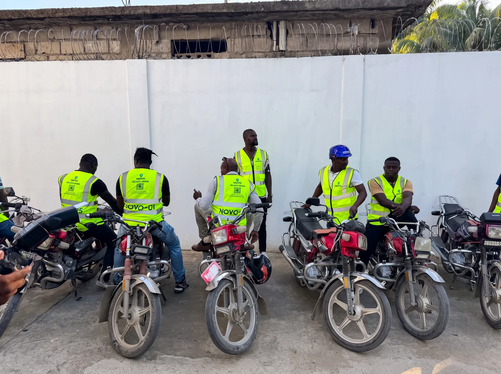NOVO pilot drivers with their motorcycles in Plaine-du-Nord